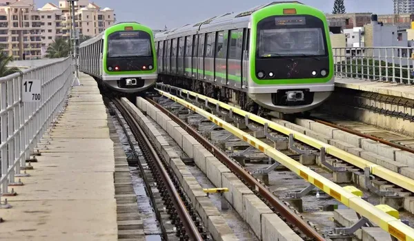 Two Namma Metro trains on elevated track in Bangalore