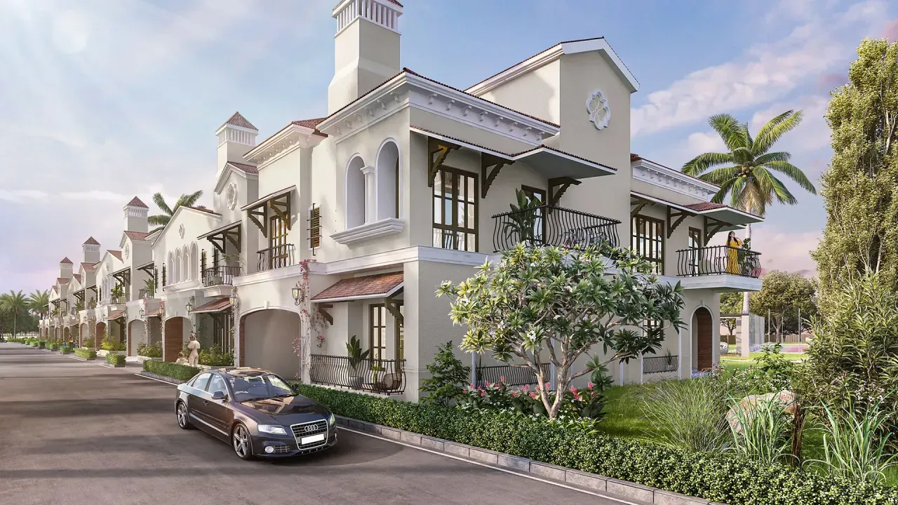 Row of double-height villas with tiled roofs, arched porches and balconies along a landscaped internal road &mdash; representative image of the villa format planned at Prestige Bangalore