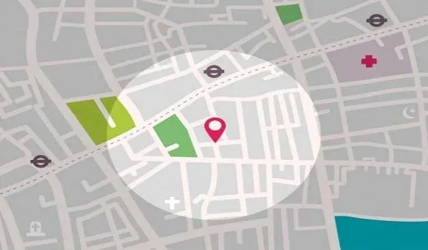 Stylised illustration of a street map with a red location pin marking a site beside a main road
